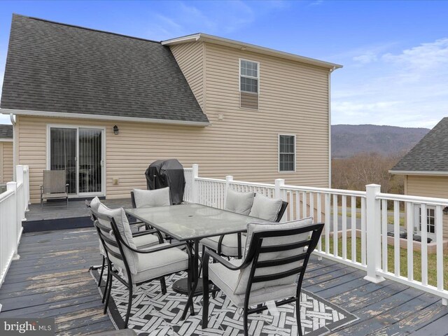 317 Locustdale Loop, Shenandoah, VA 22849 - wooden deck with outdoor dining space and a mountain view
