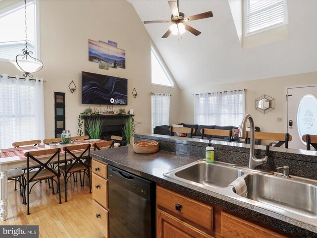 317 Locustdale Loop, Shenandoah, VA 22849 - kitchen with black dishwasher, a sink, high vaulted ceiling, open floor plan, and light wood-style flooring