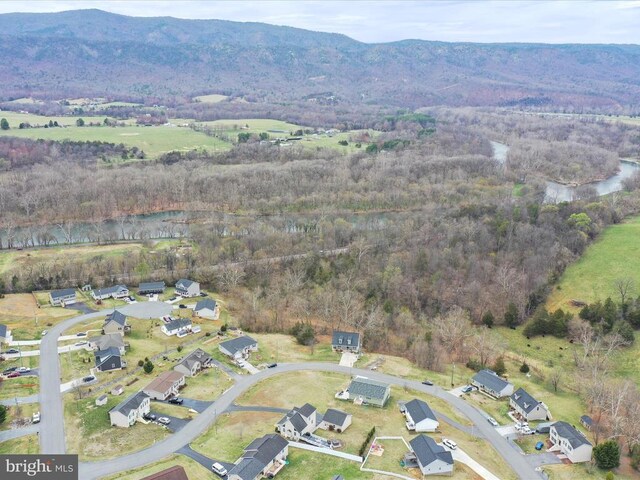 317 Locustdale Loop, Shenandoah, VA 22849 - aerial view of property and surrounding area featuring a mountainous background, a forest, and nearby suburban area