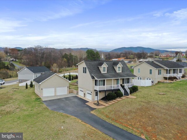 317 Locustdale Loop, Shenandoah, VA 22849 - view of front of property with a porch, a mountain view, a detached garage, driveway, and a residential view
