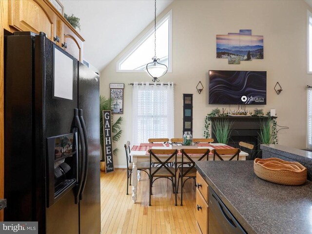 317 Locustdale Loop, Shenandoah, VA 22849 - kitchen featuring black appliances, light wood-style floors, dark countertops, hanging light fixtures, and a fireplace