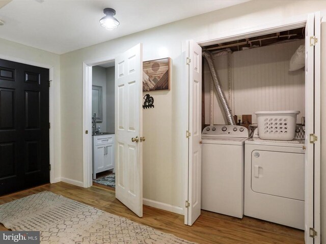 317 Locustdale Loop, Shenandoah, VA 22849 - laundry area featuring independent washer and dryer, wood finished floors, and baseboards