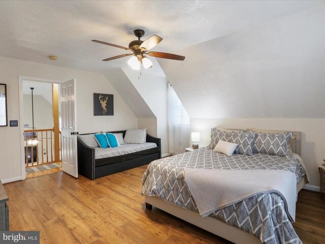 317 Locustdale Loop, Shenandoah, VA 22849 - bedroom featuring wood finished floors, vaulted ceiling, and ceiling fan