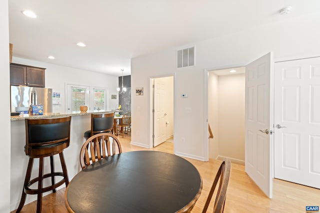 139 Longwood Dr, Charlottesville, VA 22903 - dining area featuring light wood-type flooring, recessed lighting, a chandelier, and baseboards