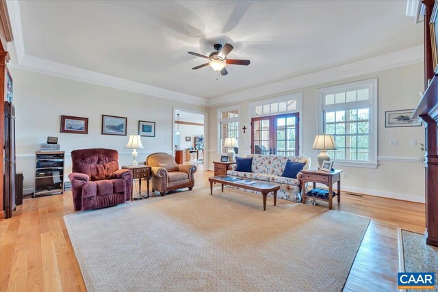 1660 Lees Mill Ln, Goode, VA 24556 - living room featuring a ceiling fan, crown molding, light wood-style flooring, and baseboards