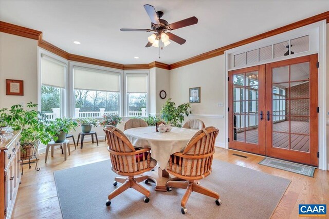 1660 Lees Mill Ln, Goode, VA 24556 - dining area featuring french doors, crown molding, light wood finished floors, and a ceiling fan