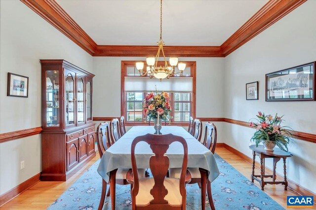 1660 Lees Mill Ln, Goode, VA 24556 - dining room featuring a chandelier, ornamental molding, light wood finished floors, and baseboards