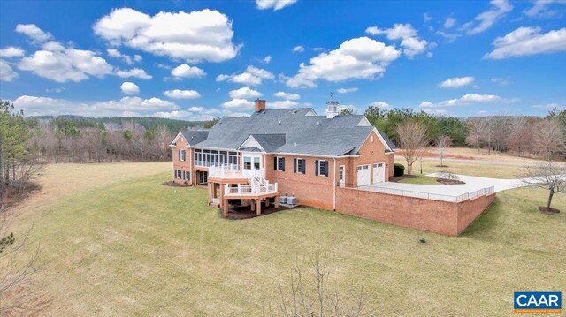 1660 Lees Mill Ln, Goode, VA 24556 - rear view of property featuring a lawn, concrete driveway, a garage, and a deck