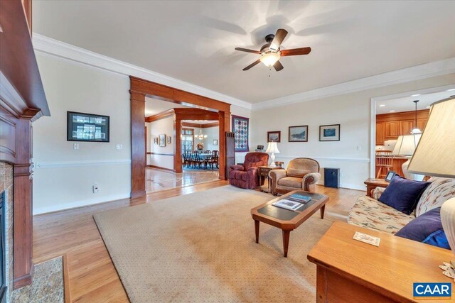 1660 Lees Mill Ln, Goode, VA 24556 - living area with ceiling fan, light wood-style flooring, ornamental molding, a fireplace, and baseboards