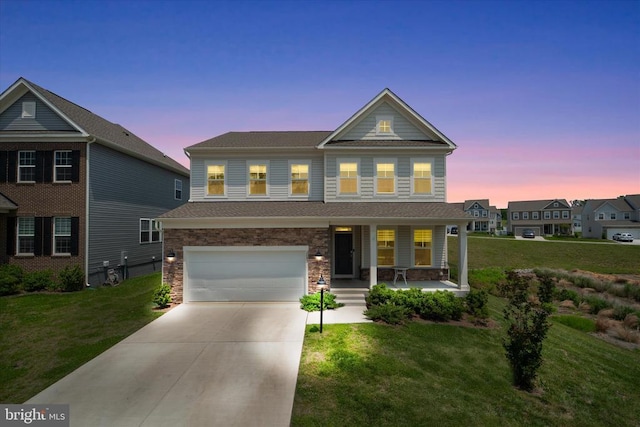2093 Whithorn Hl, Jeffersonton, VA 22724 - view of front facade with a porch, an attached garage, concrete driveway, and a front lawn