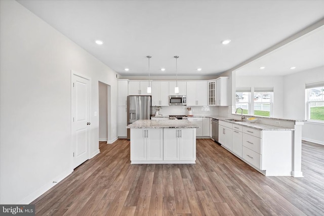 2093 Whithorn Hl, Jeffersonton, VA 22724 - kitchen featuring stainless steel appliances, wood finished floors, white cabinets, and recessed lighting