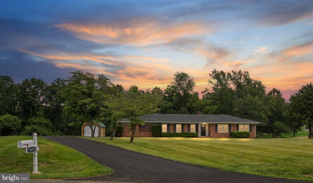 19253 Rolling Hills Dr, Culpeper, VA 22701 - view of front of property featuring a shed, a yard, brick siding, driveway, and a detached garage