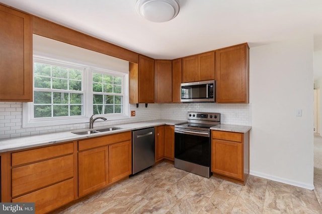 19253 Rolling Hills Dr, Culpeper, VA 22701 - kitchen with stainless steel appliances, light countertops, tasteful backsplash, and brown cabinets