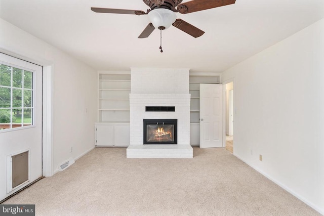 19253 Rolling Hills Dr, Culpeper, VA 22701 - unfurnished living room featuring carpet flooring, a fireplace, ceiling fan, and built in shelves