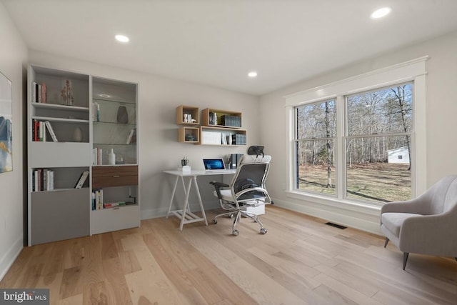 office with recessed lighting, wood finished floors, and baseboards