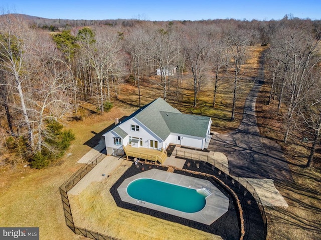 birds eye view of property featuring a view of trees