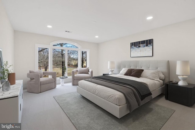 bedroom with recessed lighting, visible vents, and light colored carpet