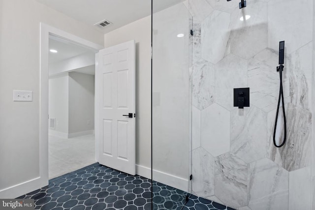 full bathroom featuring a marble finish shower, visible vents, and baseboards