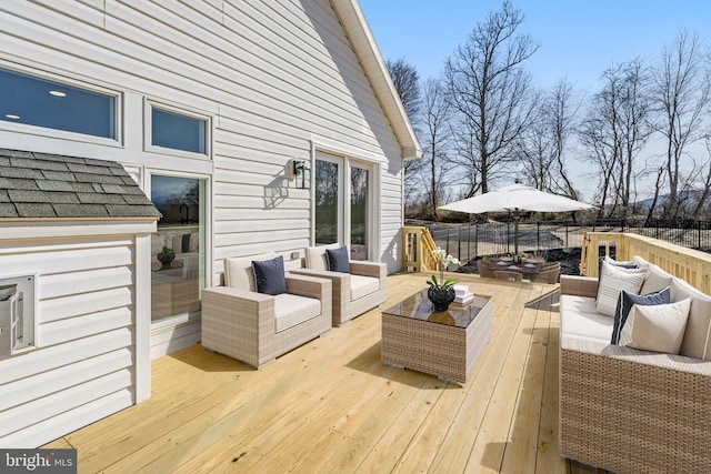 wooden deck with outdoor lounge area