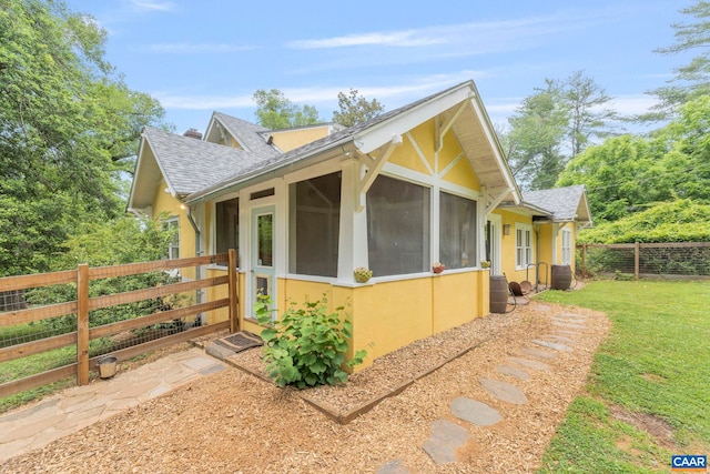 2523 Stony Point Rd, Charlottesville, VA 22911 - view of side of property featuring roof with shingles, stucco siding, and a sunroom