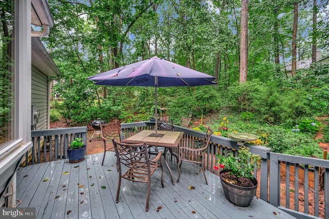 215 Mt Pleasant Dr, Locust Grove, VA 22508 - wooden deck with outdoor dining space and view of scattered trees