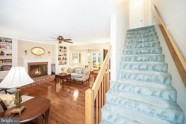 215 Mt Pleasant Dr, Locust Grove, VA 22508 - stairs featuring ceiling fan, wood finished floors, built in features, and a fireplace