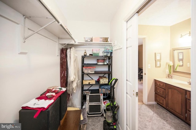 215 Mt Pleasant Dr, Locust Grove, VA 22508 - walk in closet featuring a sink and light tile patterned floors