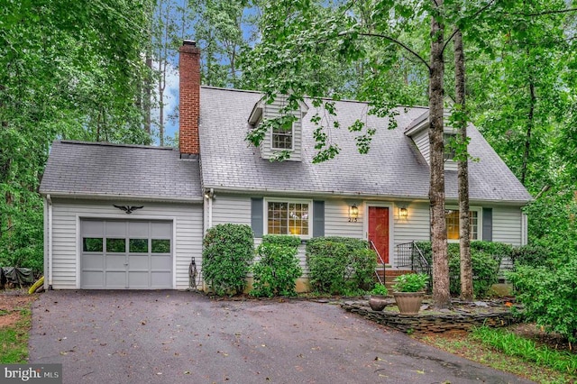 215 Mt Pleasant Dr, Locust Grove, VA 22508 - cape cod house featuring an attached garage, a chimney, and driveway