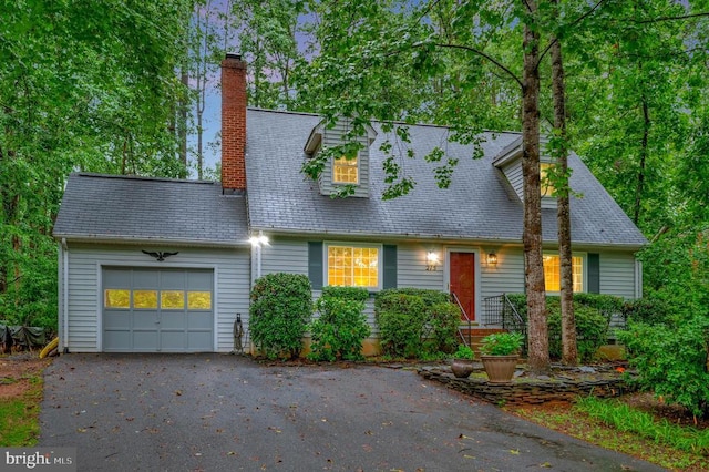 215 Mt Pleasant Dr, Locust Grove, VA 22508 - cape cod house featuring a garage, driveway, and a chimney