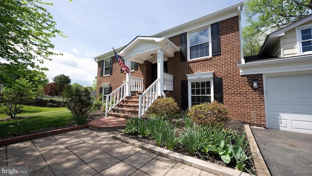 - split foyer home featuring brick siding