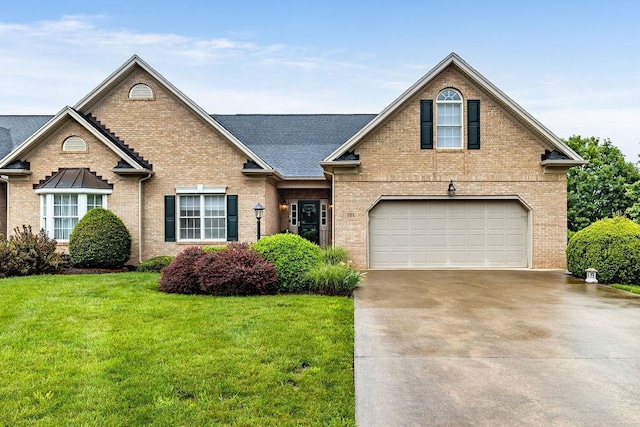 101 Jasper Ln, Waynesboro, VA 22980 - traditional-style home featuring brick siding, concrete driveway, a front yard, and a garage