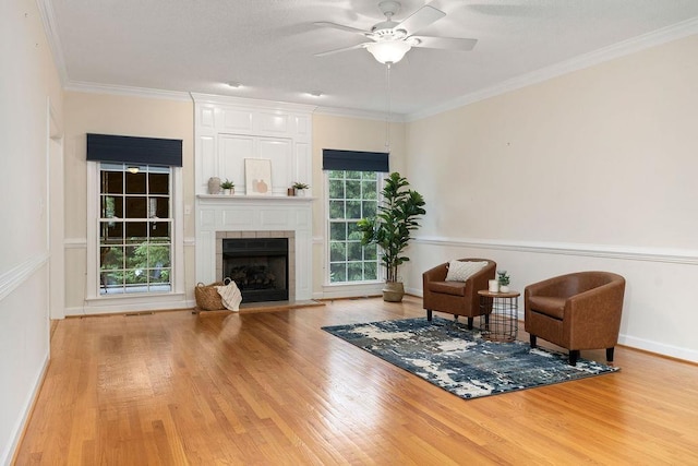 101 Jasper Ln, Waynesboro, VA 22980 - living area featuring wood finished floors, a ceiling fan, a fireplace, and crown molding