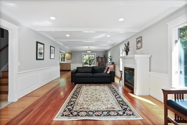 162 Hartman Ct, Mcgaheysville, VA 22840 - living room with beam ceiling, wood finished floors, a fireplace with flush hearth, stairway, and a wainscoted wall