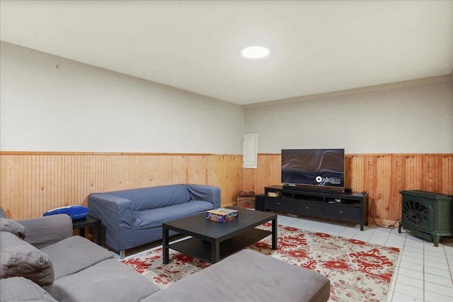162 Hartman Ct, Mcgaheysville, VA 22840 - living area with wainscoting, a wood stove, wooden walls, and light tile patterned flooring