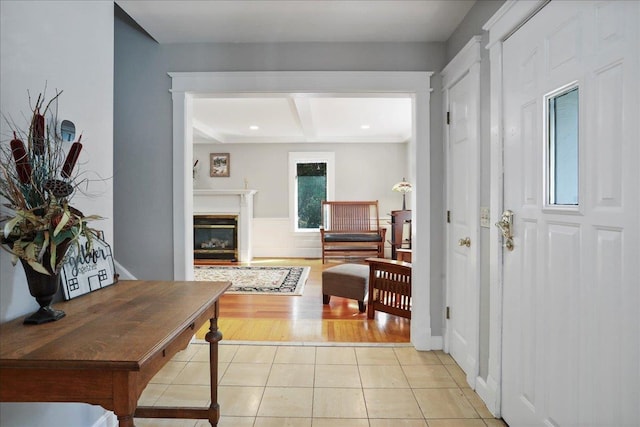 162 Hartman Ct, Mcgaheysville, VA 22840 - entryway featuring beamed ceiling, light tile patterned flooring, and a glass covered fireplace