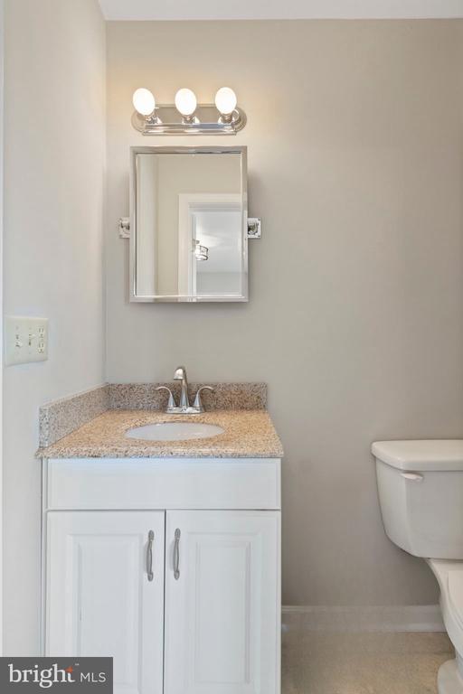9 Twin Springs Dr, Fredericksburg, VA 22407 - half bath with vanity, toilet, and baseboards