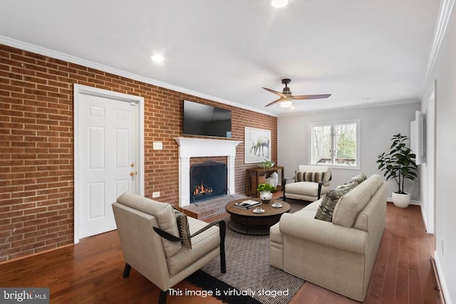 9 Twin Springs Dr, Fredericksburg, VA 22407 - living room featuring brick wall, hardwood / wood-style floors, ceiling fan, ornamental molding, and a fireplace