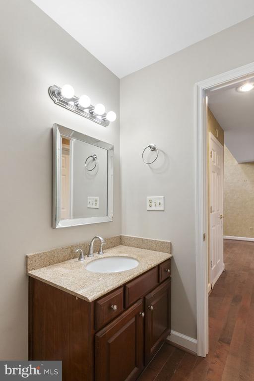 9 Twin Springs Dr, Fredericksburg, VA 22407 - bathroom with baseboards, wood finished floors, and vanity