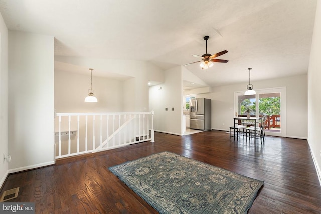  - unfurnished room with ceiling fan, wood finished floors, and vaulted ceiling