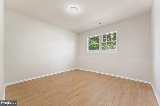  - unfurnished room with light wood-style floors and baseboards