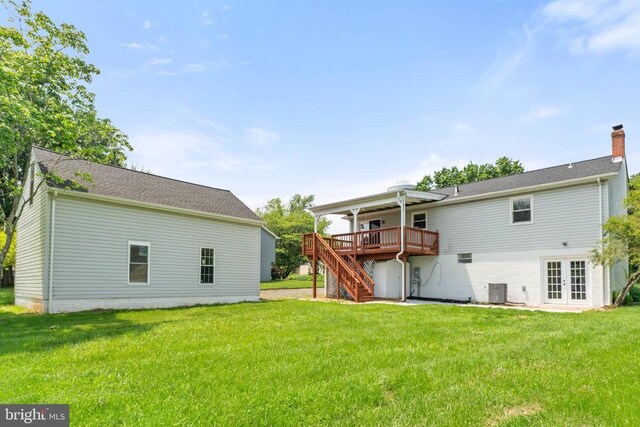  - rear view of property with french doors, stairway, a wooden deck, a yard, and a chimney