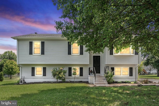  - split foyer home featuring a lawn