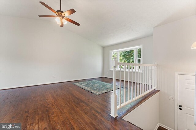  - unfurnished room with lofted ceiling, wood finished floors, and a ceiling fan