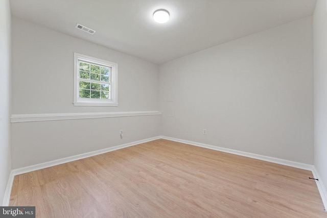  - spare room with wood finished floors and baseboards