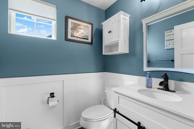  - half bathroom with vanity and wainscoting
