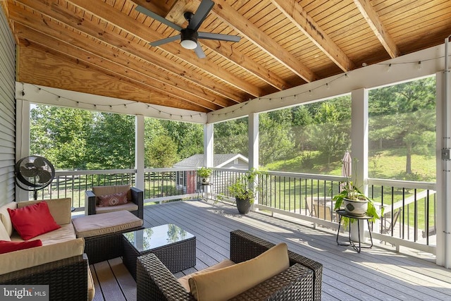  - deck featuring an outdoor living space and a ceiling fan