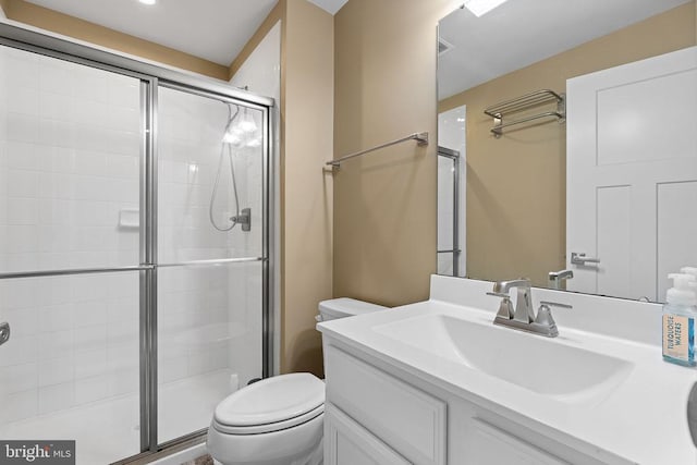  - bathroom featuring a stall shower and vanity