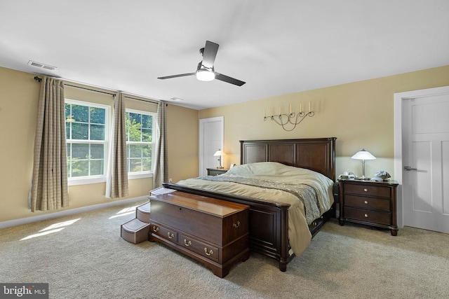  - bedroom with light carpet and ceiling fan