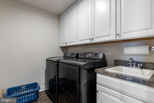  - laundry room featuring independent washer and dryer and cabinet space
