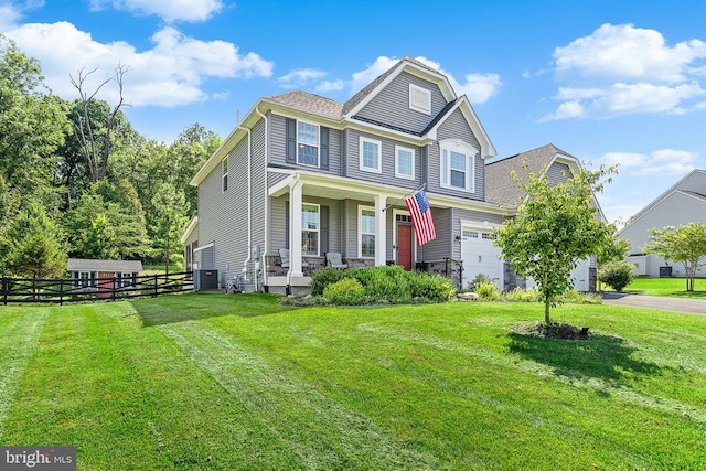  - view of front facade featuring a porch, asphalt driveway, and a garage